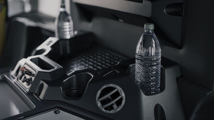 Convenient storage spots and workspaces for crew in LR electric trucks