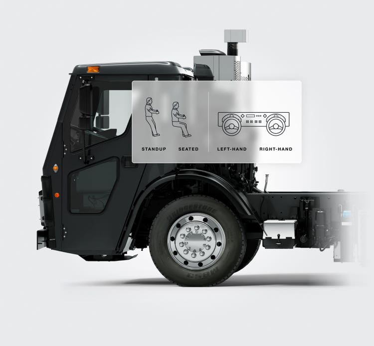 Side view of a black Mack LR Series truck chassis showcasing its ergonomic cab design with options for stand-up, seated, left-hand, or right-hand driving configurations