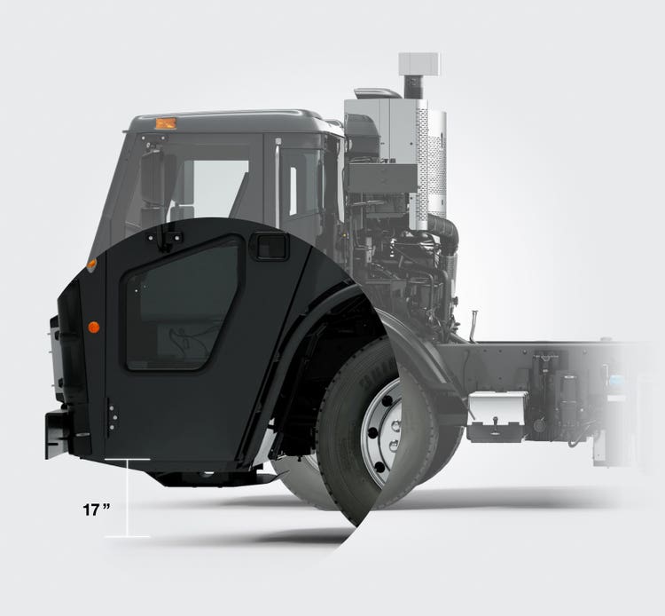 Side view of a black Mack LR Series truck cab highlighting a low 17-inch entry step, designed for easier entry and exit for operators
