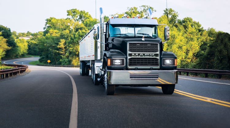 Black Mack Pinnacle truck on a city street